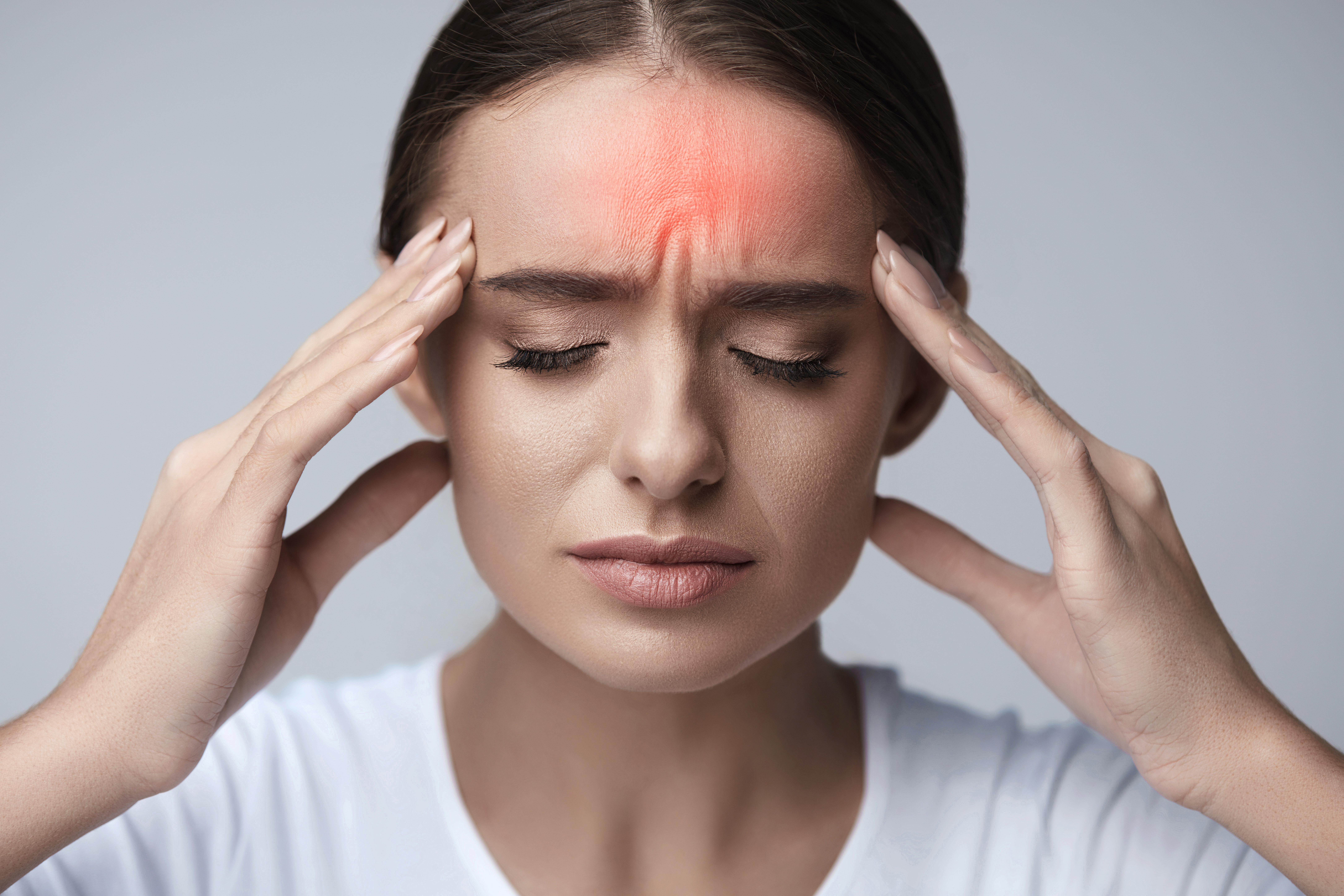 Photo illustration of a woman with a headache