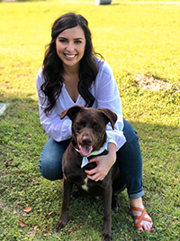 Happy woman outside with her dog